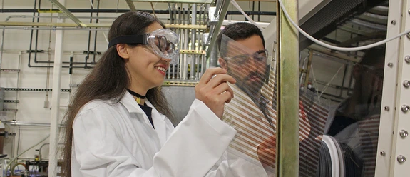 two UA MSE doctoral students in lab