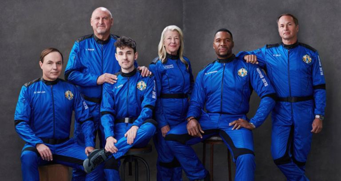 5 people  in space suits