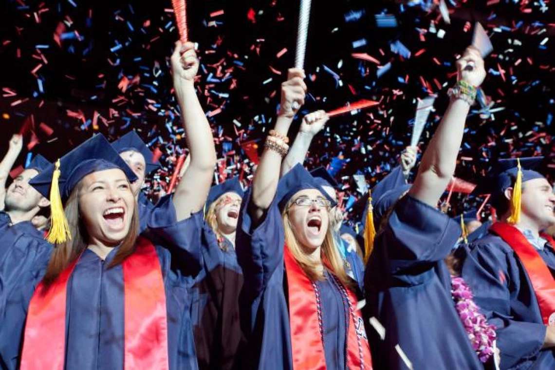 student wearing graduation regallia