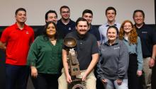 University of Arizona students pose with a trophy at the 21st annual Arizona Materials Bowl.