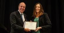 Erin Ratcliff receiving an award from Department of Energy Under Secretary for Science Paul Dabber