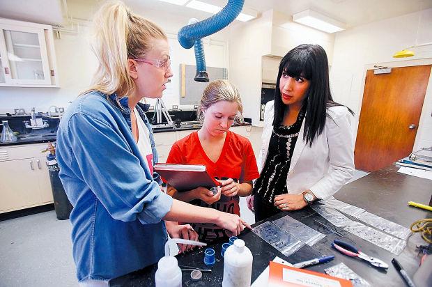 Anne Ellis, center, shown working in the Corral Lab with Ashley Ormsby, left, and Dr. Erica Corral, right. Photo courtesy Arizona Daily Star.
