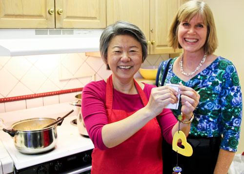 Professor Supapan Seraphin, left, takes a break from making curry to show her Ben's Bell, with engineering instructor Jennifer Horner, who nominated Seraphin for the award. (Pete Brown/UA Engineering)